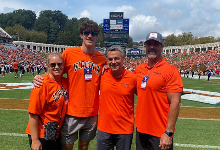 Virginia basketball commit Blake Buchanan and his family pose with UVA head coach Tony Bennett at a Virginia football game during Buchanan's official visit to UVA.